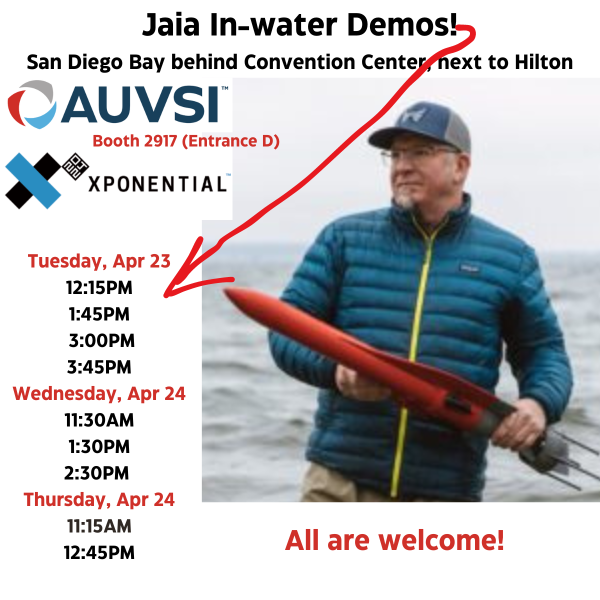 Ian holding JaiaBot with demo times for AUVSI Xponential