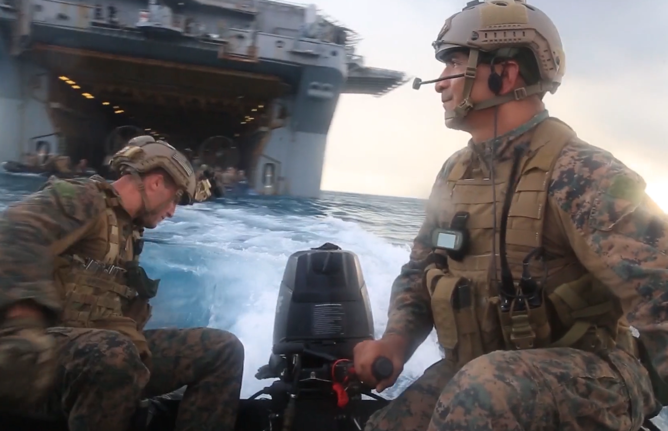 Marines disembarking from vessel to begin confirmatory beach report data collection